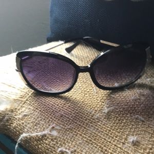 Gently used black and silver sunglassses